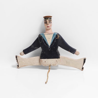 Lot 223 - A folk art jumping jack sailor toy