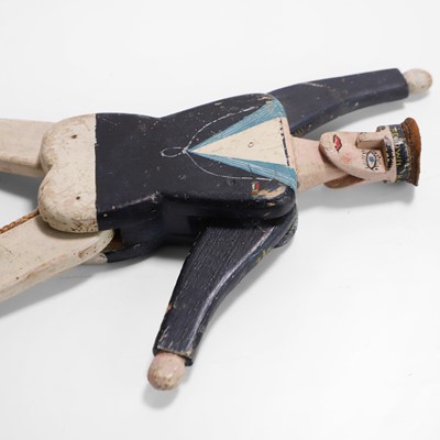 Lot 223 - A folk art jumping jack sailor toy