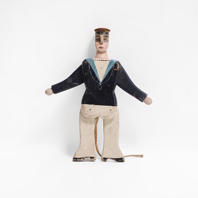 Lot 223 - A folk art jumping jack sailor toy