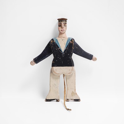 Lot 223 - A folk art jumping jack sailor toy