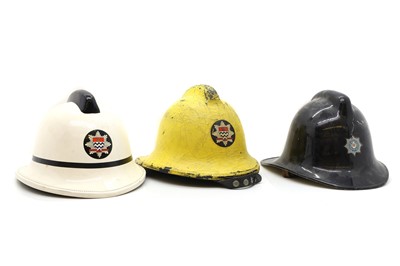 Lot 225 - Three British fireman's helmets