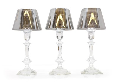 Lot 136 - A group of three Baccarat 'Flos Tech/ Harcourt Our Fire' candlesticks