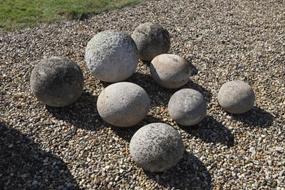 Lot 747 - A group of eight carved Cotswold stone finials or piers