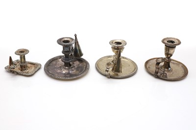 Lot 88 - A group of four silver plated chambersticks