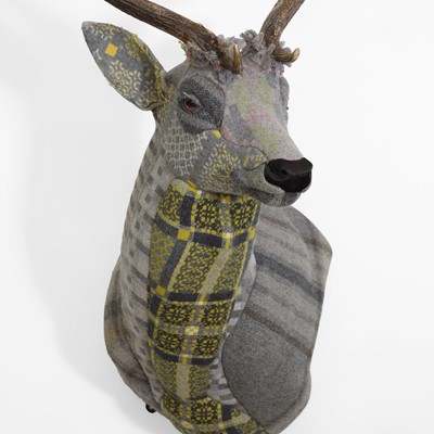 Lot 386 - A stag bust and patchwork fabric wall mount
