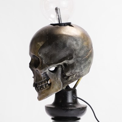 Lot 261 - A painted resin 'Plasma Skull' table lamp