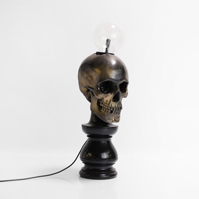 Lot 261 - A painted resin 'Plasma Skull' table lamp