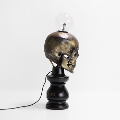 Lot 261 - A painted resin 'Plasma Skull' table lamp