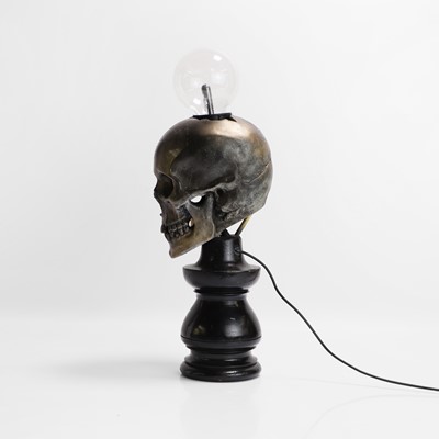 Lot 261 - A painted resin 'Plasma Skull' table lamp