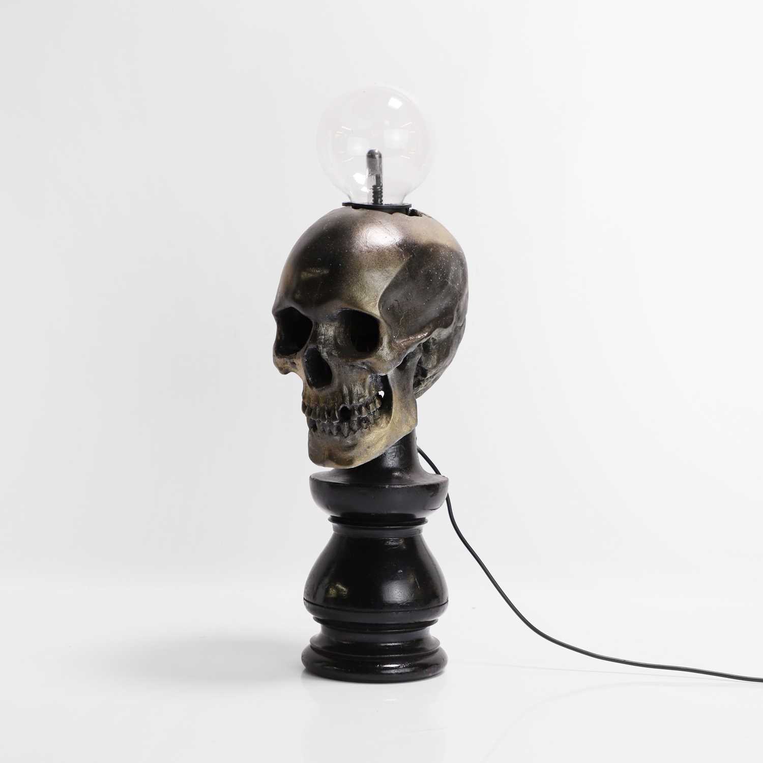 Lot 261 - A painted resin 'Plasma Skull' table lamp