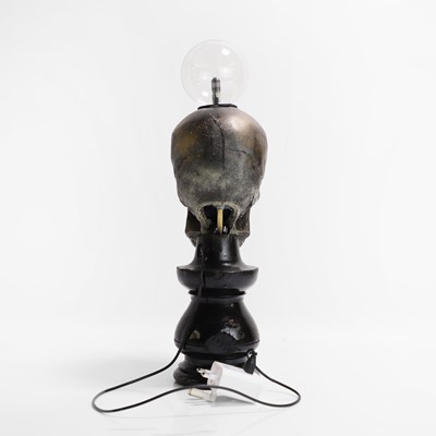 Lot 261 - A painted resin 'Plasma Skull' table lamp