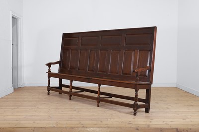 Lot 304 - A long oak settle