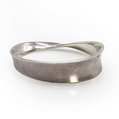 Lot 1261 - A sterling silver 'Mobius' bangle, by Georg Jensen