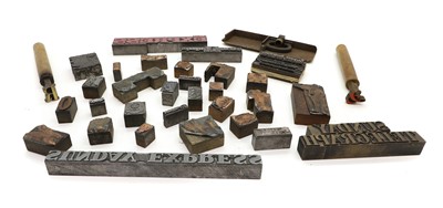 Lot 477 - A large collection of brass printing blocks and tools