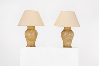 Lot 118 - A pair of Chinese-style buff glazed table lamps