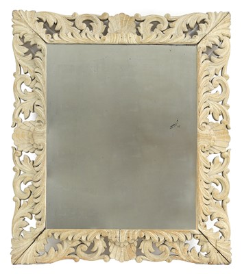 Lot 644 - A carved oak and limed wall mirror