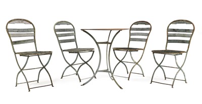 Lot 685 - A fer forgé garden table and four folding chairs