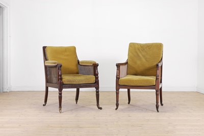 Lot 457 - A near pair of Regency mahogany bergère library armchairs