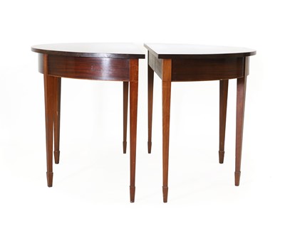 Lot 698 - A pair of George III mahogany demilune consoles tables