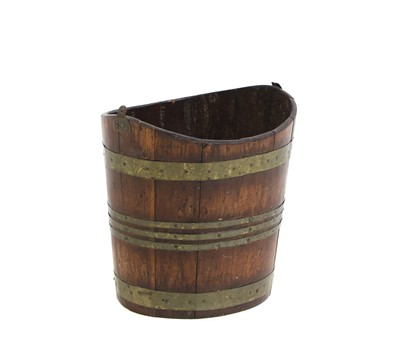 Lot 653 - A mahogany and brass bound bucket