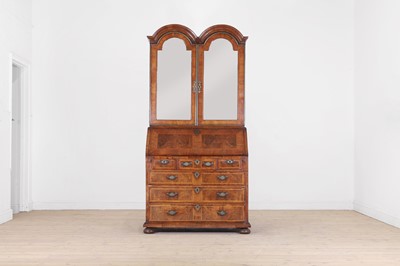 Lot 283 - A Queen Anne walnut and feather-banded bureau bookcase