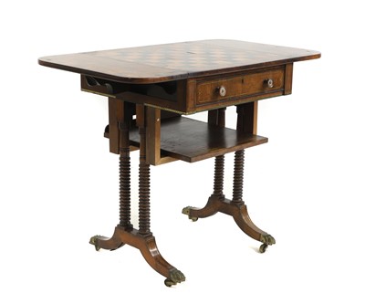 Lot 677 - A George IV rosewood and brass inlaid games table