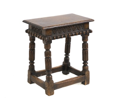 Lot 659 - An oak joint stool