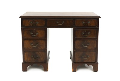 Lot 675 - A George III style mahogany pedestal desk