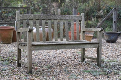 Lot 788 - A teak garden bench