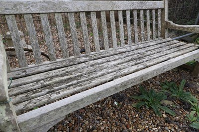 Lot 786 - A large teak garden bench
