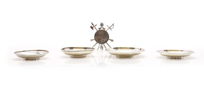 Lot 36 - A group of four silver mounted coin dishes