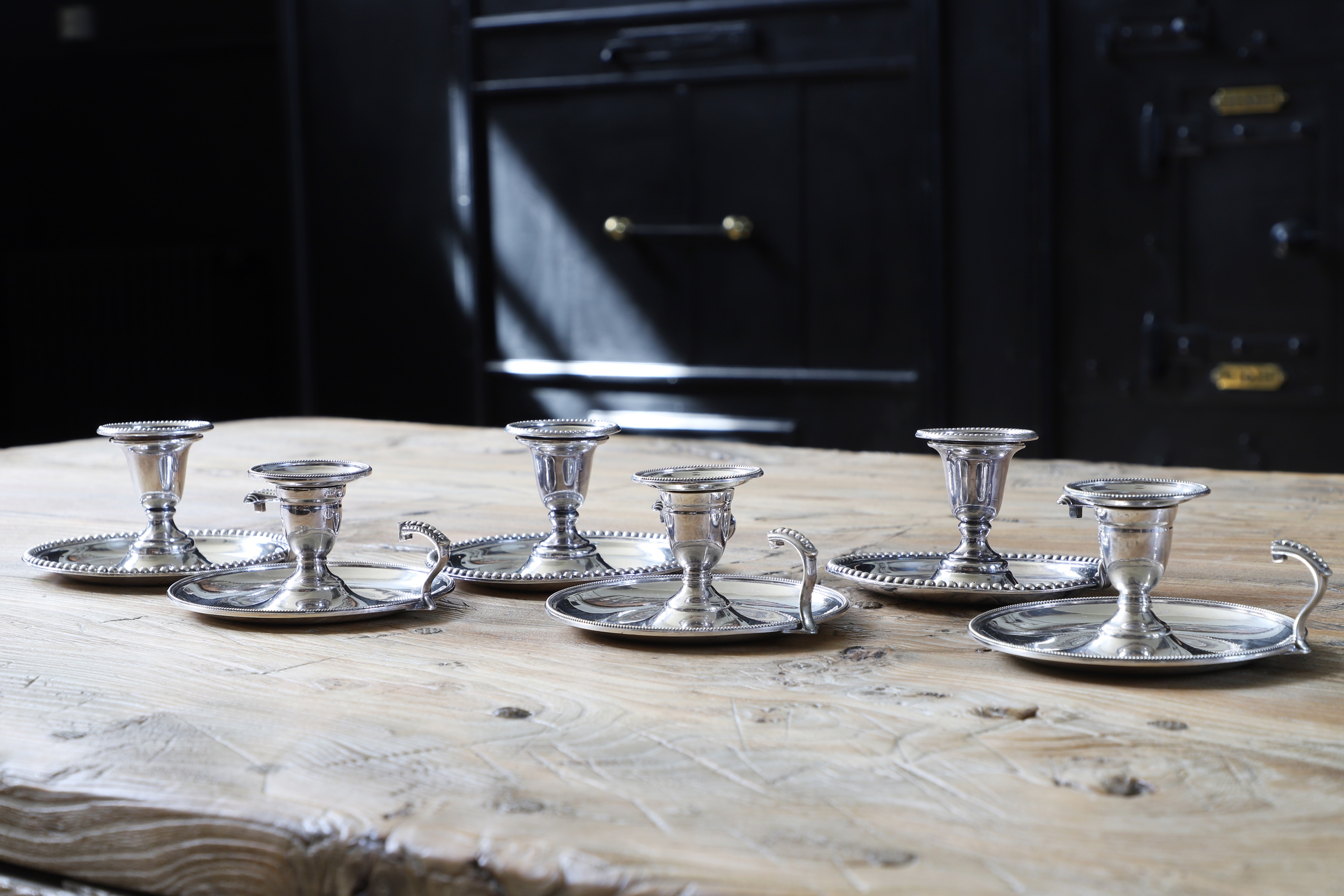 Lot 246 - Six silver-plated chambersticks,