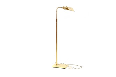 Lot 497 - A brass floorstanding reading lamp