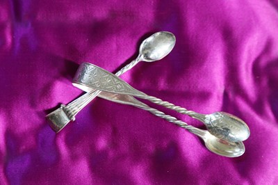 Lot 248 - Two pairs of small silver sugar tongs