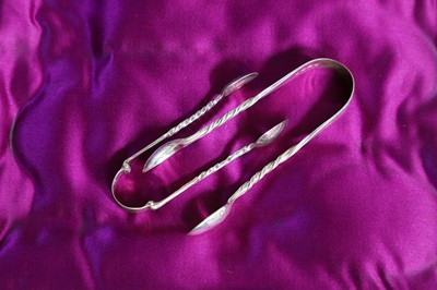 Lot 248 - Two pairs of small silver sugar tongs