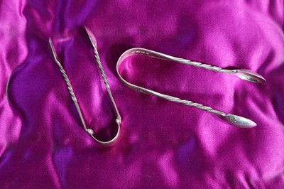 Lot 248 - Two pairs of small silver sugar tongs