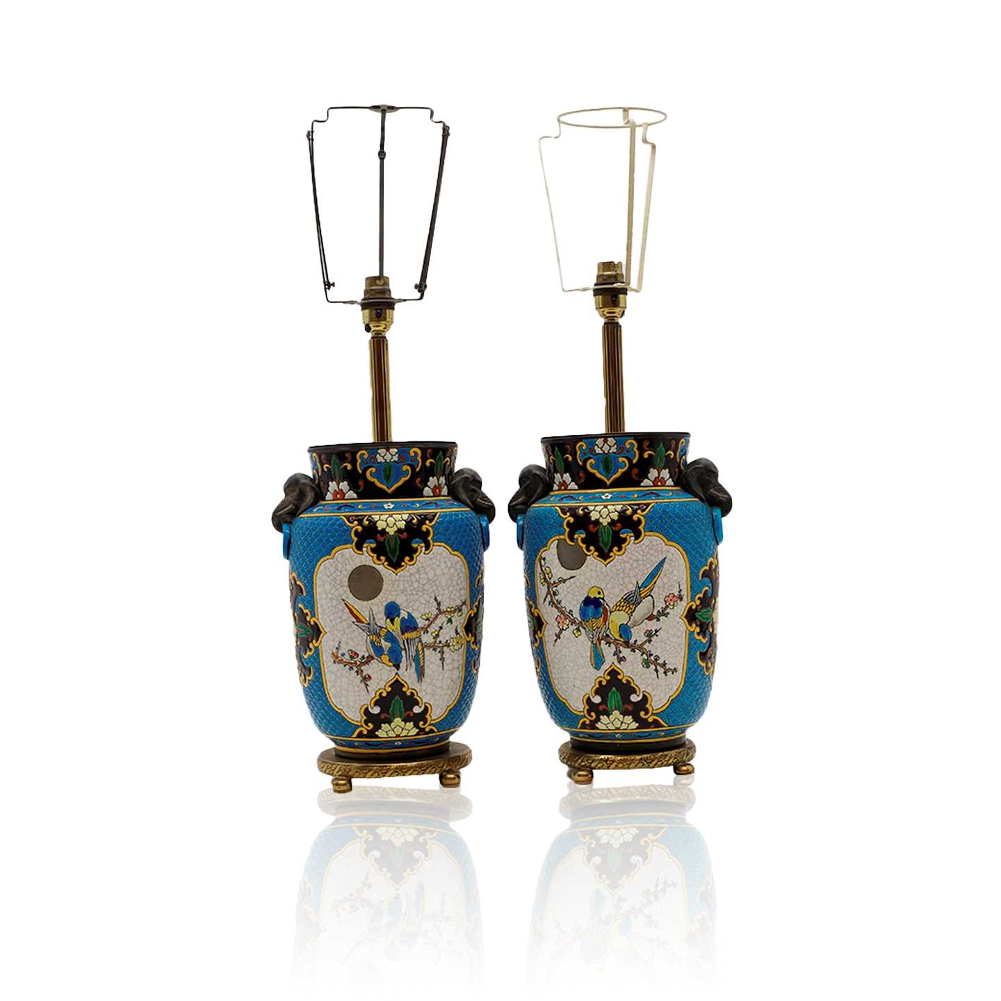 Lot 390 - A pair of French faience pottery table lamps