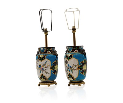 Lot 390 - A pair of French faience pottery table lamps