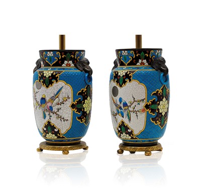 Lot 390 - A pair of French faience pottery table lamps