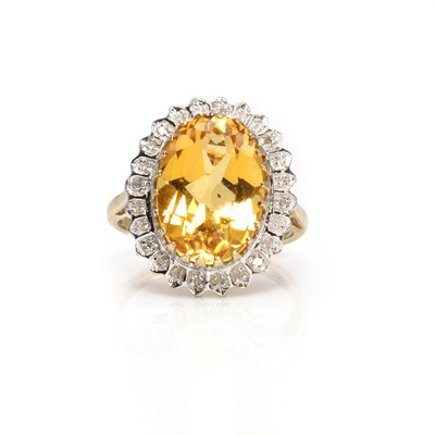 Lot 119 - A 9ct gold citrine and diamond cluster ring