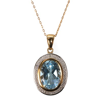 Lot 147 - A 9ct gold topaz and diamond pendant and chain