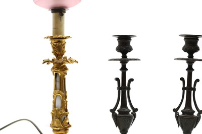 Lot 562 - A gilt bronze and milk glass table lamp