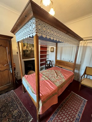 Lot 622 - A fruitwood single four poster bed