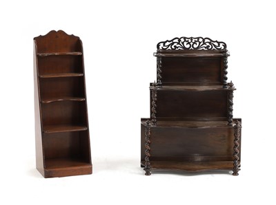 Lot 563 - A walnut four-tier open wall shelf