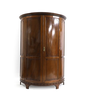 Lot 619 - A mahogany demi-lune wardrobe