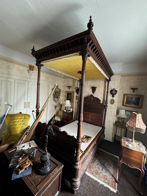 Lot 621 - A carved oak four poster single bed