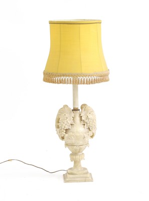 Lot 553 - An alabaster table lamp