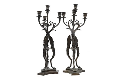 Lot 207 - A pair bronze Regency style four light candelabra