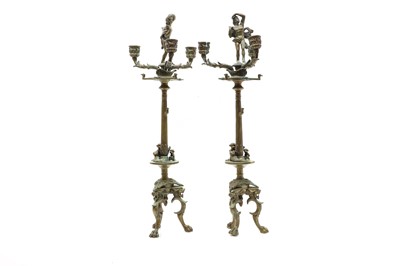 Lot 206 - A pair of Regency style brass candelabra