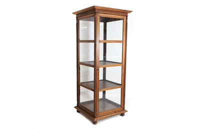 Lot 495 - An oak display cabinet